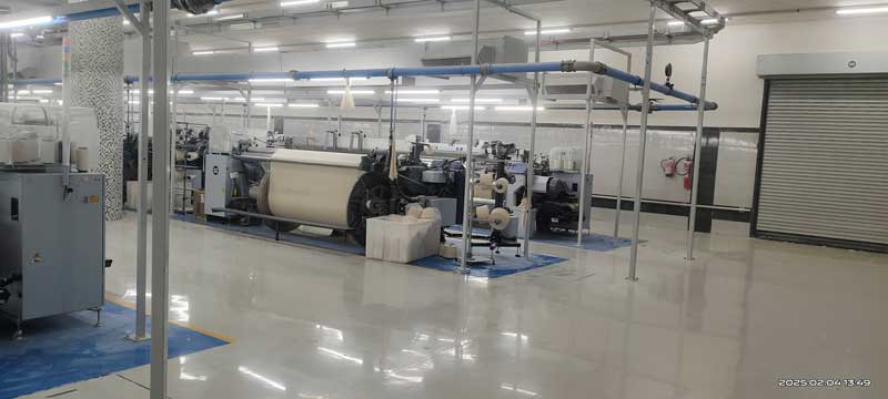 Modern textile manufacturing unit with weaving and spinning machines – Dharmshil Group