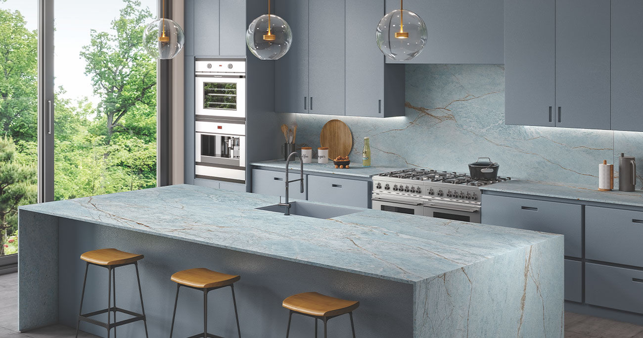 Modern blue-themed kitchen interior with textured porcelain tiles