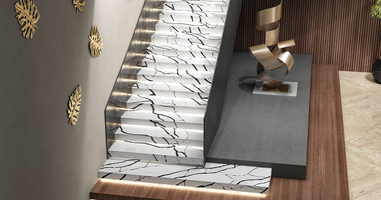 Staircase lined with veined marble-effect porcelain tiles