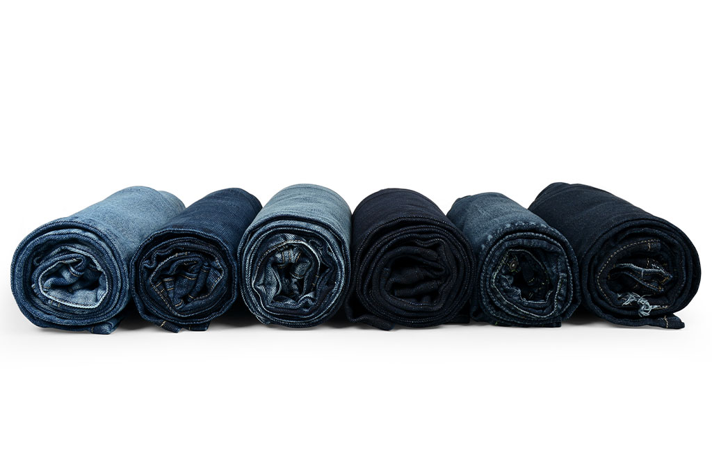 Black rolled fabric bundles ready for export to garment and textile manufacturers